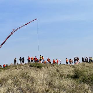 toeschouwers in het duin